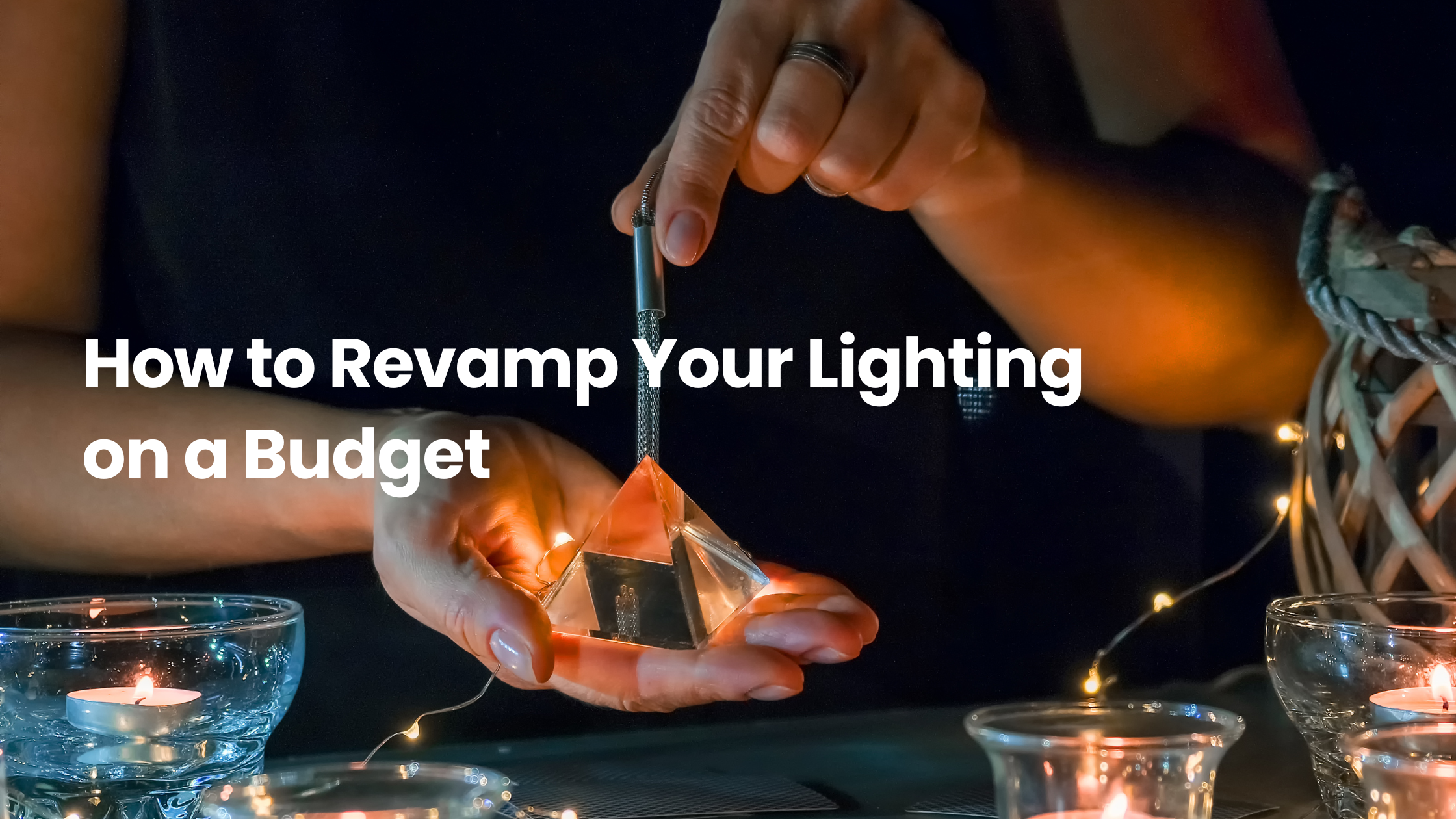Hands arranging a glowing decorative light with candles and string lights, illustrating affordable ways to revamp your home lighting on a budget.