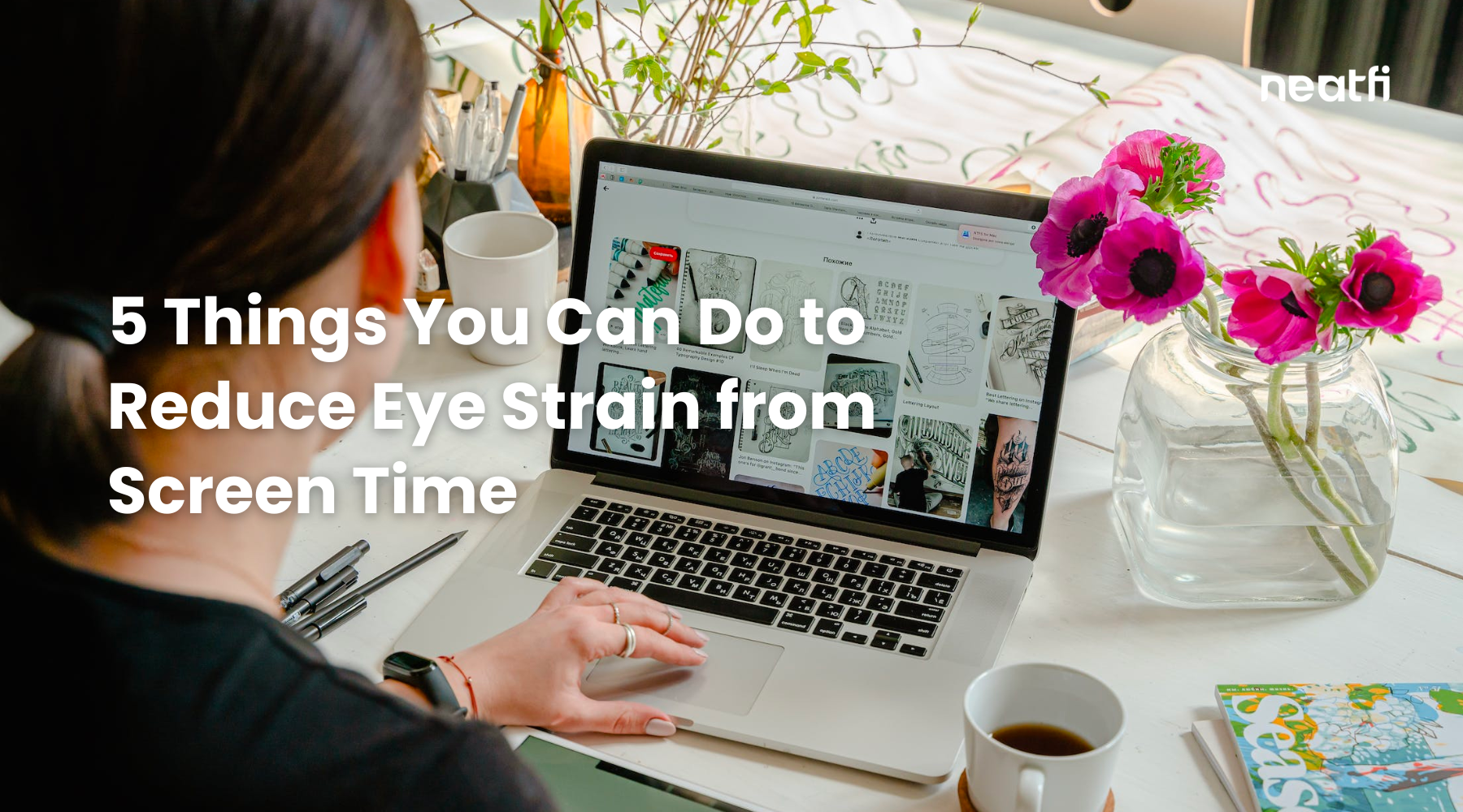 Person working on a laptop at a bright desk with flowers and coffee, illustrating tips to reduce eye strain from extended screen time.